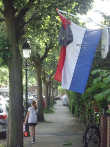 Dutch flag with graduation backpack at Adventures in Expat Land